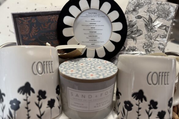 Neutral-toned gift basket with coffee mug, lidded candle, and framed sentiment
