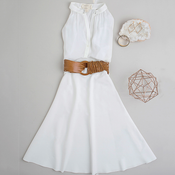 Front Door Fashion white sleeveless dress with leather belts and gold accessories