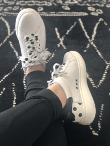 Kate Spade sneakers lefot over right