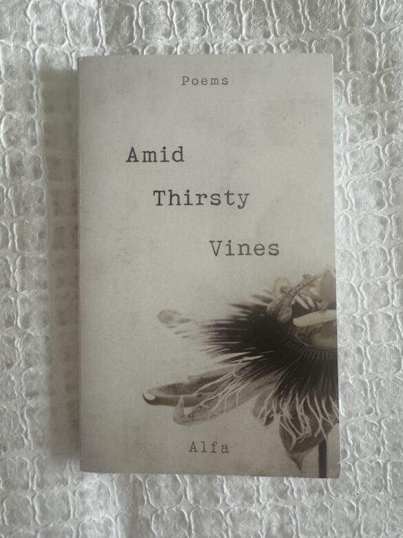 A picture of the Amid Thirsty Vines poetry book, purchased used, showing the cover