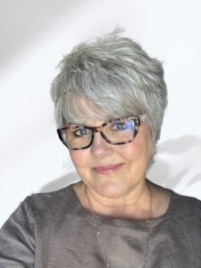 Deborah Bass, personal blogger and writer, smiling in a natural light portrait