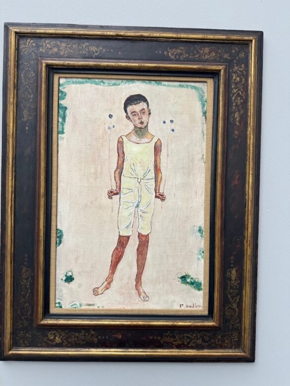 Painting titled Charmed Boy by Ferdinand Hodler, showing a young boy in profile against a soft-toned background, displayed at the Kunstmuseum Lucerne