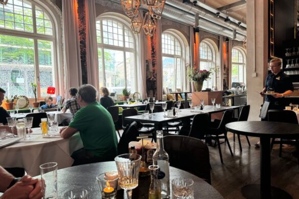 Interior of The Anchor restaurant in Lucerne with rustic tables and large windows