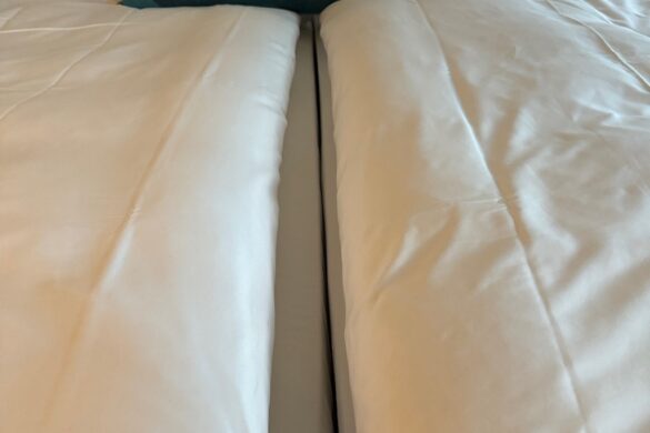 European-style double bed at Hotel Rebstock in Lucerne—two twin beds pushed together, each with its own bedding.