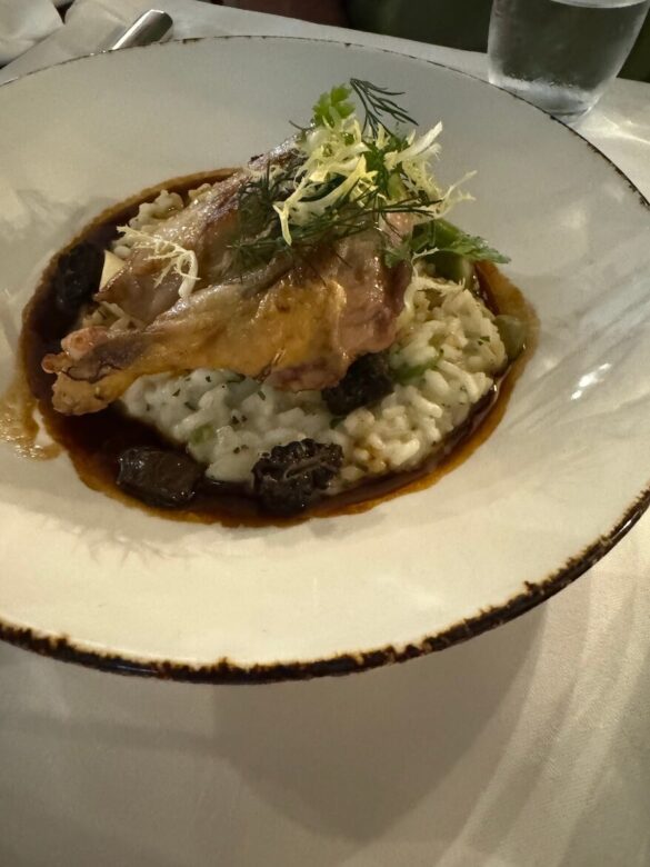 Corn-fed chicken with morel mushroom risotto and truffle jus served at Hotel Wilden Mann, Lucerne.