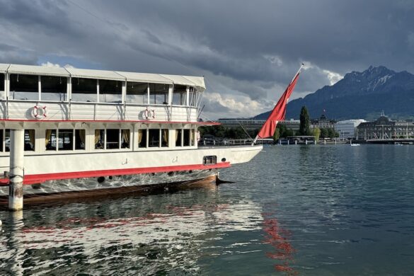A passenger ferry docked on Lake Lucerne under cloudy skies, part of Deborah Bass’s 33 Days in Europe adventure.