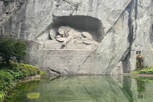 Lion Monument in Lucerne with green pond in foreground
