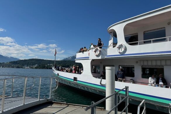 Ferry in Lucerne marina with snow-capped Alps in the background