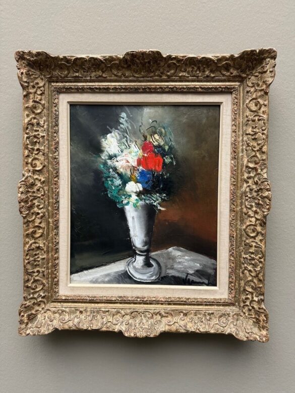Framed painting of colorful flowers in a tall silver vase, painted in bold, loose strokes, by Raoul Dufy in 1941.
