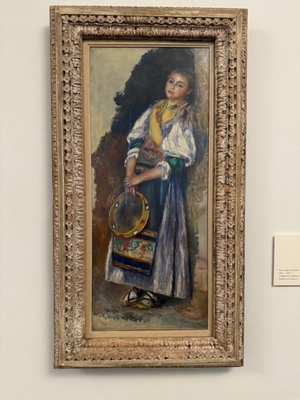 Oil painting of a young woman in traditional Italian dress holding a tambourine, by Pierre-Auguste Renoir.