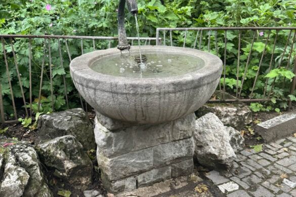 Small stone fountain at the Lion Monument in Lucerne, Switzerland