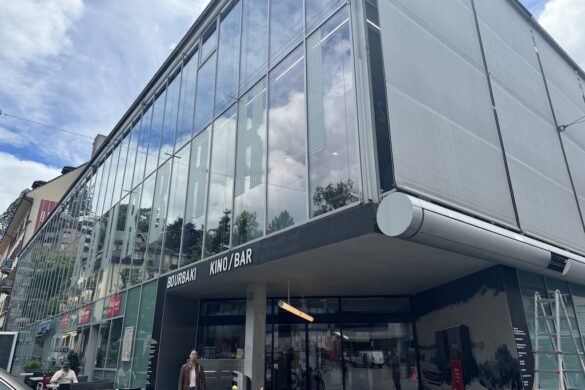 Exterior of the Bourbaki Panorama building with glass facade in Lucerne.