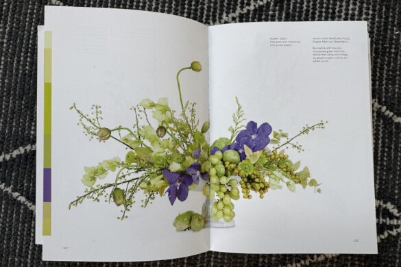 Book spread showing a floral arrangement in chartreuse with purple accent, Flower Color Theory, page 122.