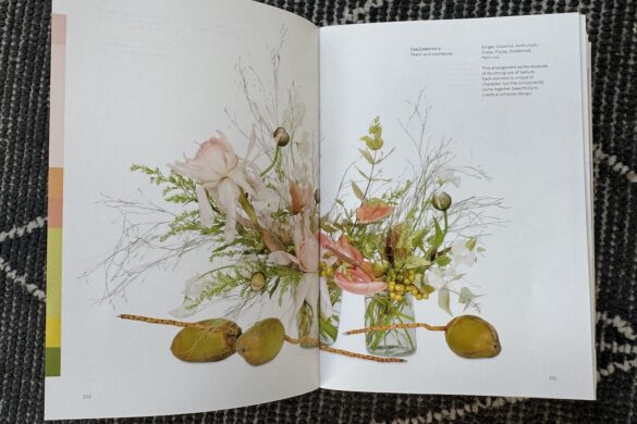 Book spread showing a floral arrangement in coral with green accent, Flower Color Theory, page 100.