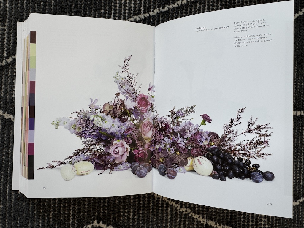 Book spread showing an analogous floral arrangement in lavender, lilac, purple, and plum hues, Flower Color Theory, page 354.