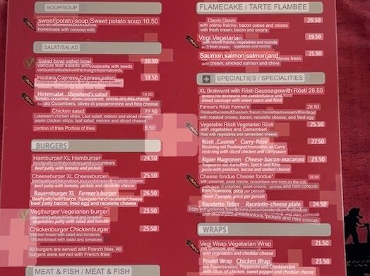 Restaurant menu translated to English via Google Lens at Restaurant Schützen in Lauterbrunnen with soups, burgers, rösti, and specialties listed