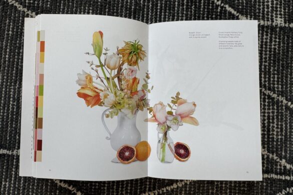 Book spread showing a floral arrangement in orange with pink accent, Flower Color Theory, page 94.