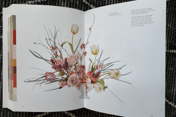 Book spread showing a floral arrangement in peach and white, Flower Color Theory, page 238.