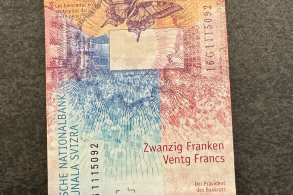 Back of the red Swiss 20 franc banknote featuring butterflies and vibrant patterns in red, orange, and blue