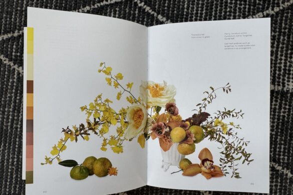 Book spread showing a transitional floral arrangement in yellow, orange, and green, Flower Color Theory, page 200.