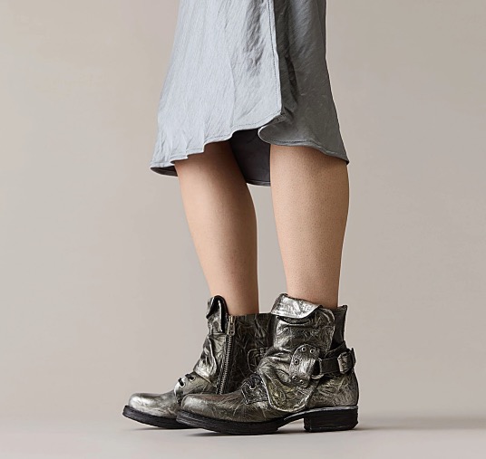 Woman with a bllue skirt wearing A.S .98 Boots Simon II in silver.