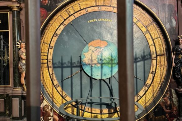 Astronomical clock inside Strasbourg Cathedral with painted panels and ornate details