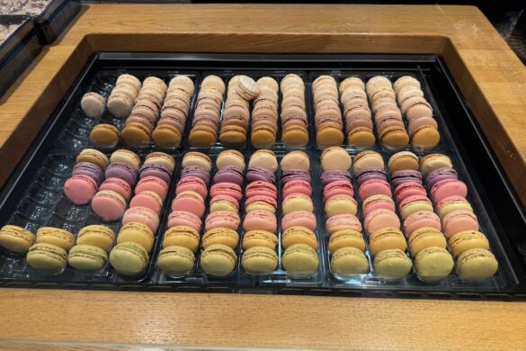 Tray of colorful macarons in a pastry shop display
