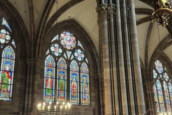 Wide interior view of Strasbourg Cathedral showing the nave and seating