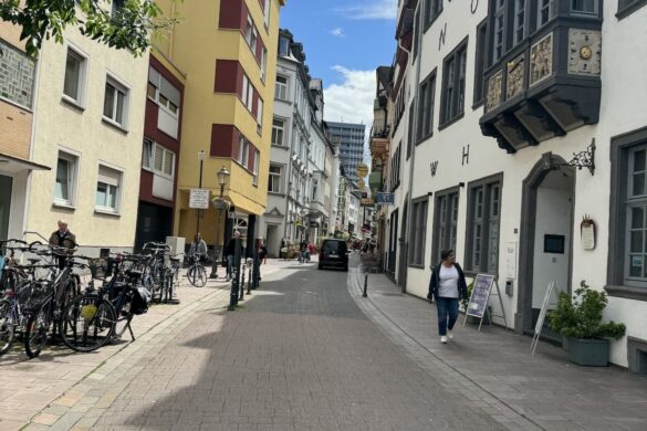 cobblestone pedestrian street lined with historic buildings in Koblenz Old Town