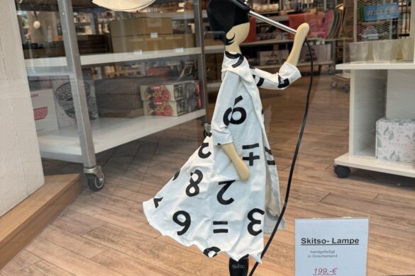 Alt text: artistic lamp sculpture shaped like a stylized figure in Koblenz Old Town