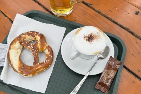 soft pretzel beer and cappuccino on tray at riverside beer garden