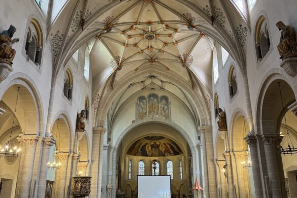 Alt text: central nave and arches inside St. Castor Basilica in Koblenz