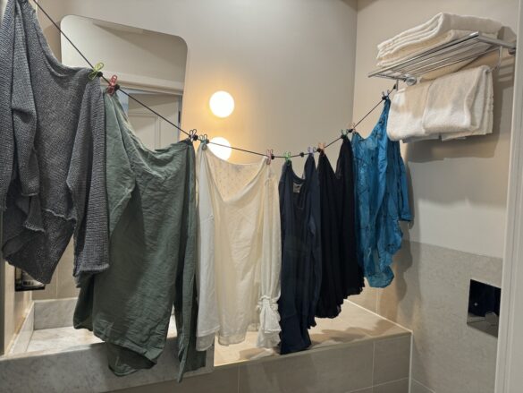 travel clothes hanging to dry in hotel bathroom in Amsterdam