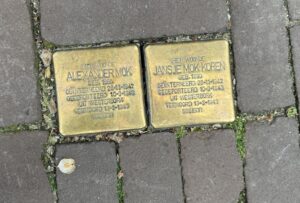 stolpersteine memorial stones for Alexander Mok and Jansje Mok-Koren in a sidewalk in Amsterdam