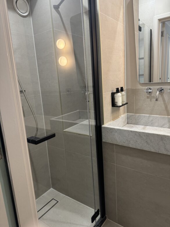modern hotel bathroom with glass shower at the times hotel amsterdam