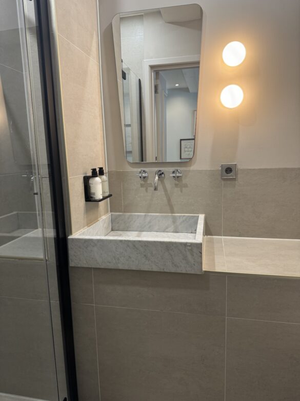 bathroom sink and mirror inside the times hotel room in amsterdam
