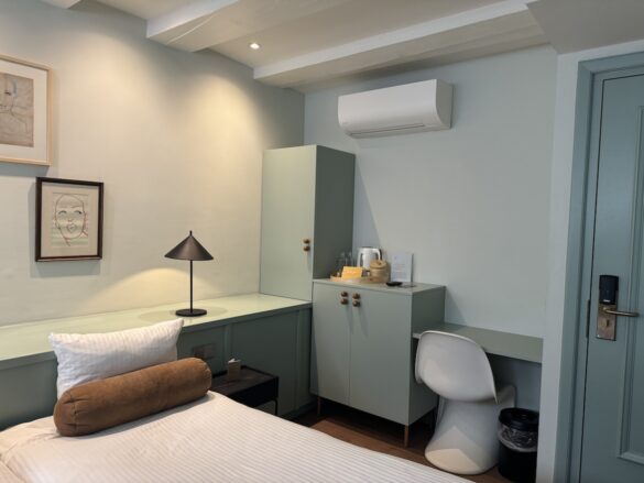 hotel room interior with twin beds and soft lighting at the times hotel in amsterdam