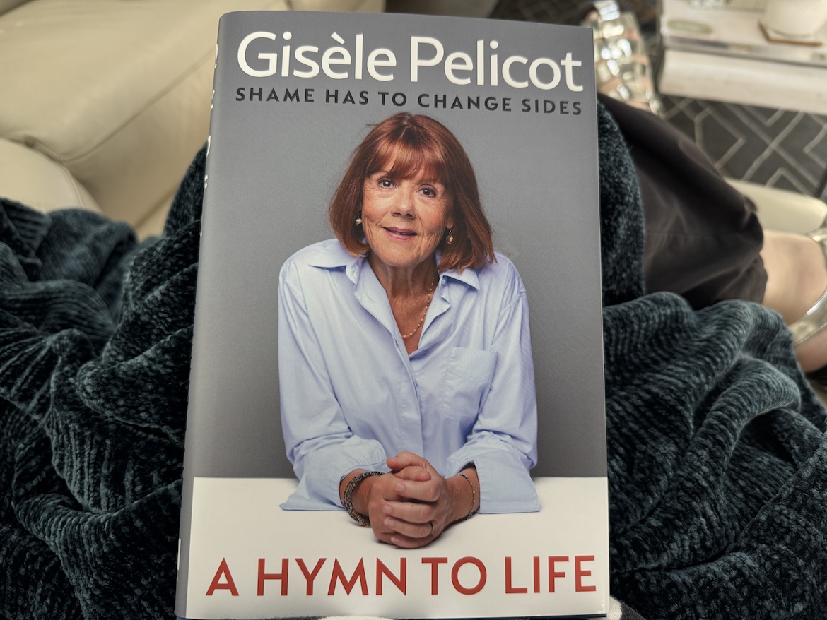 book cover of A Hymn to Life by Gisèle Pelicot showing the author seated outdoors