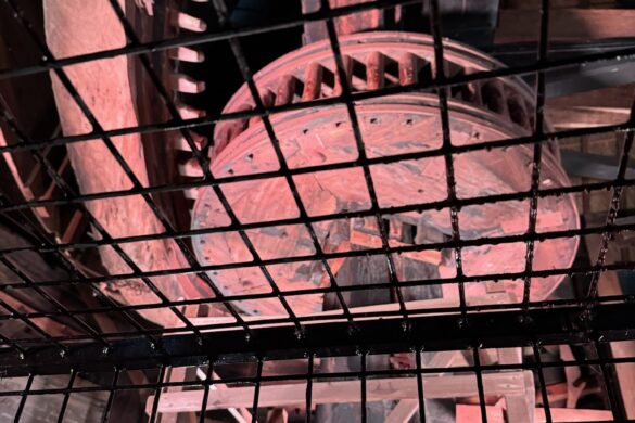 large wooden gears inside historic Kinderdijk windmill machinery