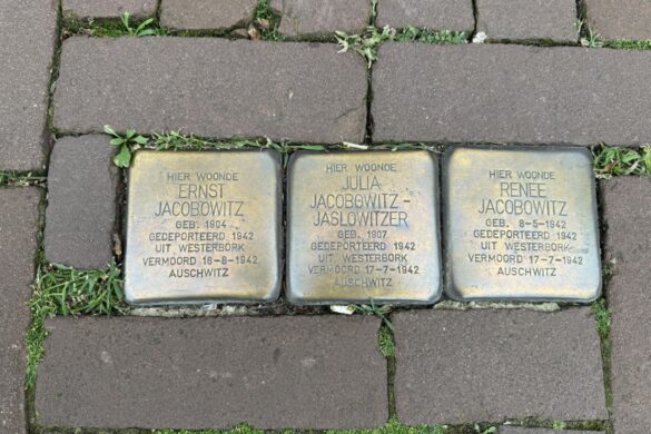 Three Stolpersteine memorial stones for Ernst, Julia, and Renée Jacobowitz set into an Amsterdam sidewalk