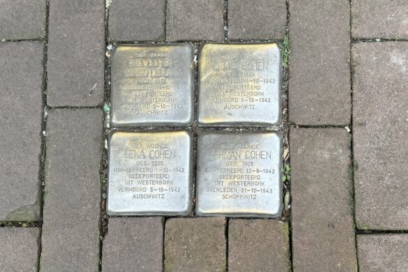 Four Stolpersteine memorial stones for Eva, Levie, Lena, and Herman Cohen set into an Amsterdam sidewalk