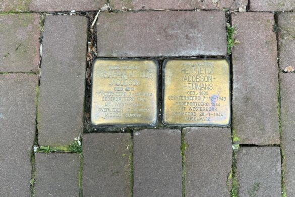 Two Stolpersteine memorial stones for Henrietta Jacobson-Heijmans and Abraham Arthur Jacobson set into an Amsterdam sidewalk