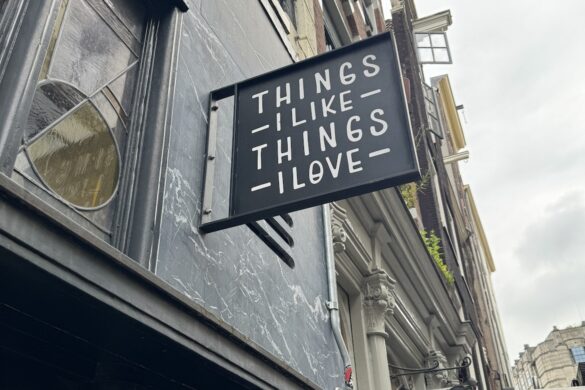 Black storefront sign reading Things I Like Things I Love on an Amsterdam street