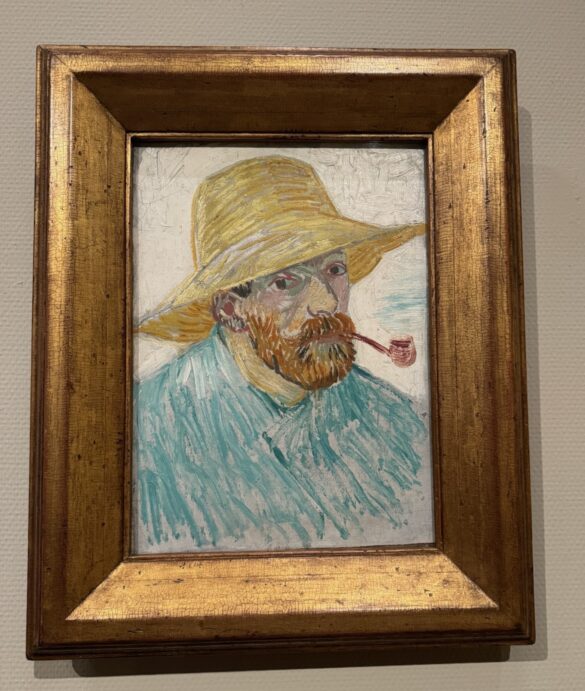 Vincent van Gogh self-portrait with straw hat and pipe in gilded frame at the Van Gogh Museum