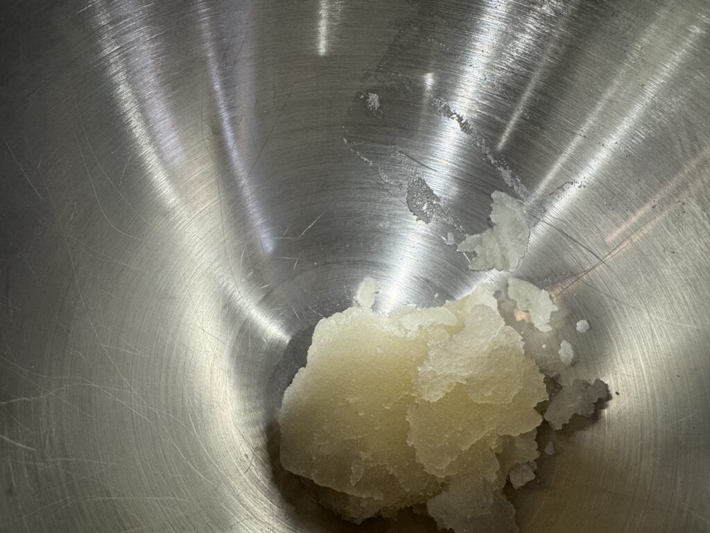 Gelatin and water mixture in stainless steel KitchenAid mixer bowl