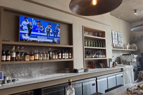 Bar interior at Sipeos restaurant in Walnut Creek showing bottles, glassware, and the beverage service area