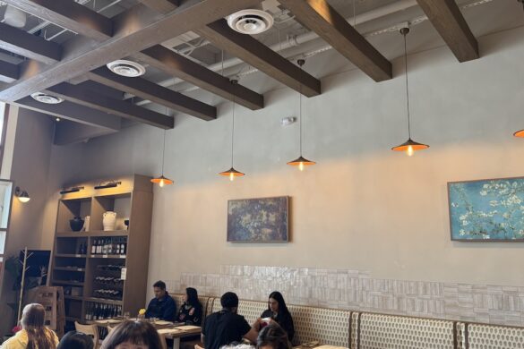 Dining room interior at Sipeos restaurant in Walnut Creek with seating, artwork, and warm lighting