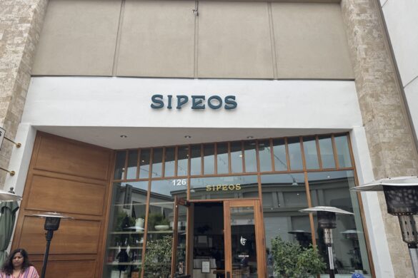 Exterior entrance of Sipeos restaurant in Walnut Creek with signage, patio heaters, and front doors