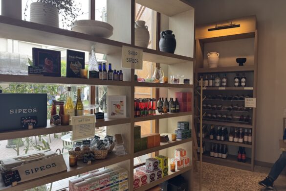 Retail shop area inside Sipeos restaurant in Walnut Creek showing teas, cocktail books, drink ingredients, gifts, and wine displays