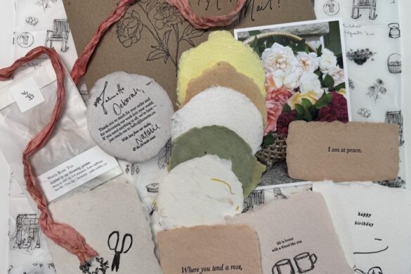 Second Farmette Card Subscription Collection Contents of the second Farmette Card Subscription including handmade paper, ribbon, postcards, and botanical stationery.